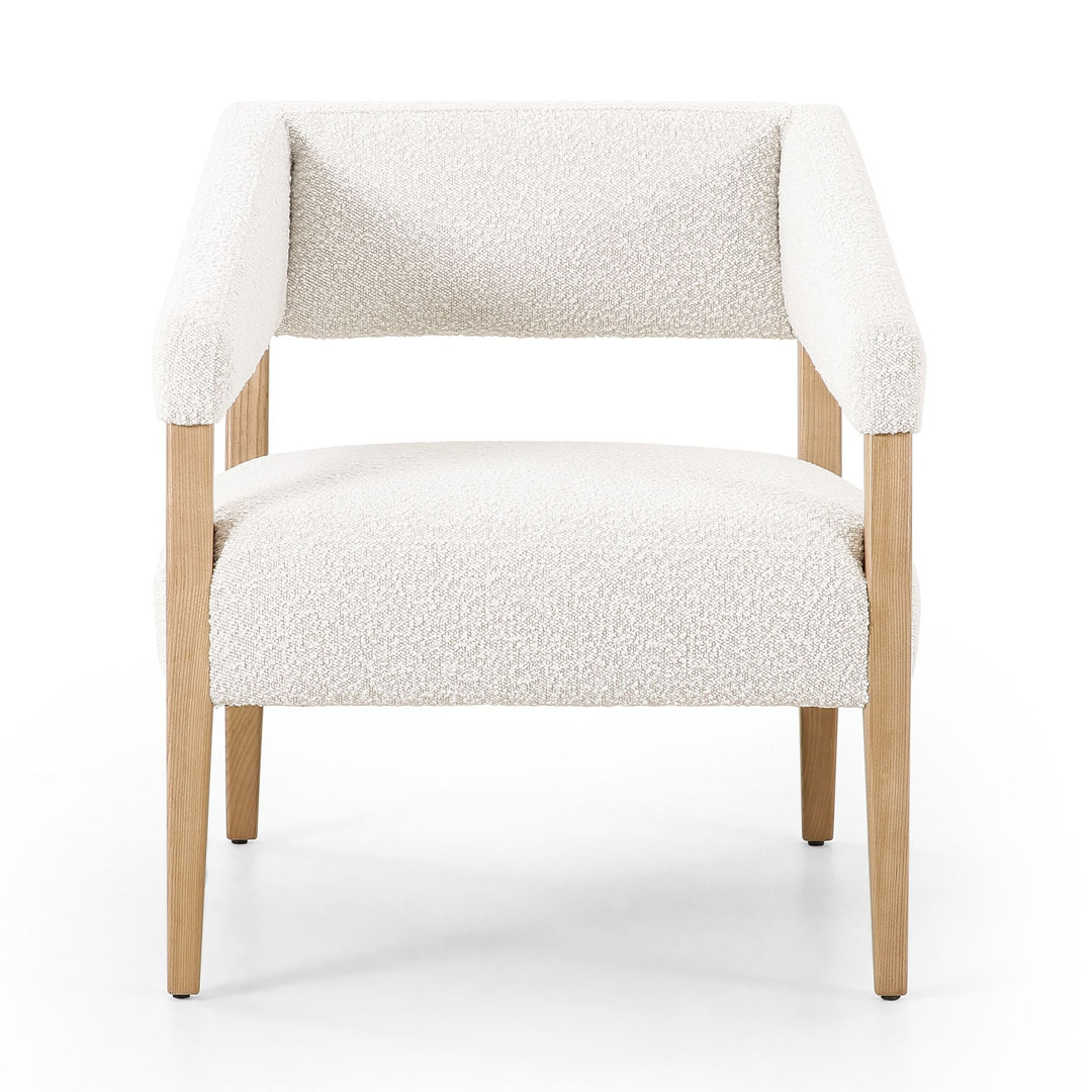 Club Accent Chair with bouclé fabric and wood legs in various finishes for modern interiors.