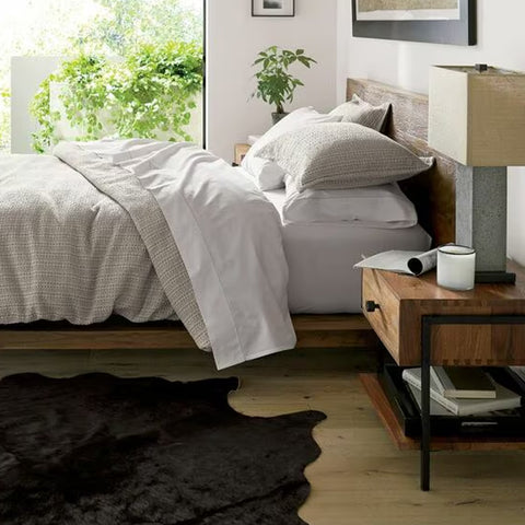 Foot Board Bed with Alnoor Tactile headboard and footboard, modern platform design in a contemporary bedroom setting with matching side tables and dresser