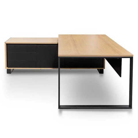 Janel Managers Table with built-in power port, black steel loop legs, and side cabinet storage.