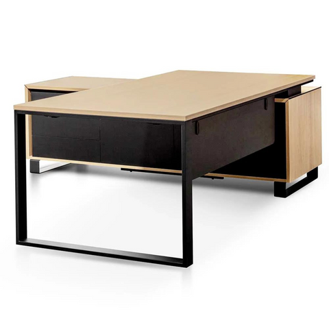 Janel Managers Table with built-in power port, black steel loop legs, and side cabinet storage.