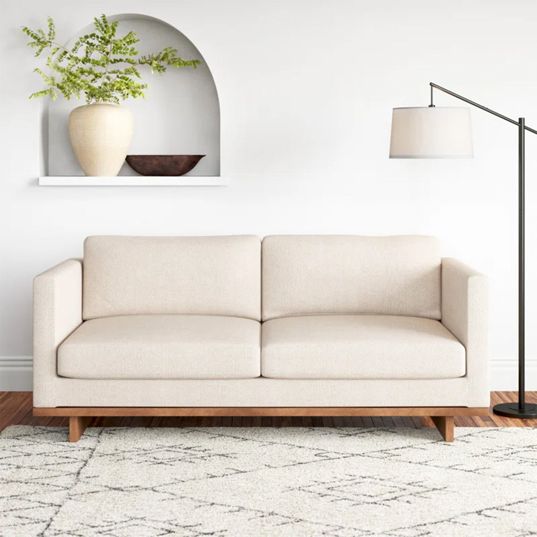 Morello Wood Base Sofa with square arms, solid rubberwood base, and fibre-filled cushions in a modern design.