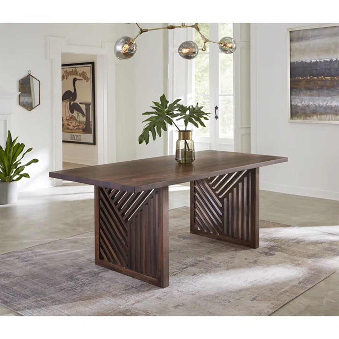 Rafaella Dining Table with veneered polished top and brown stainless steel base in a modern dining room.