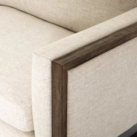 Square Reding Upholstered Sofa with loose back cushions and solid wood frame in brown finish.