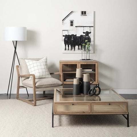 Warner Chisel Console with glass-paneled doors, solid yellow pine wood frame, and matching centre table in a modern living room setup.
